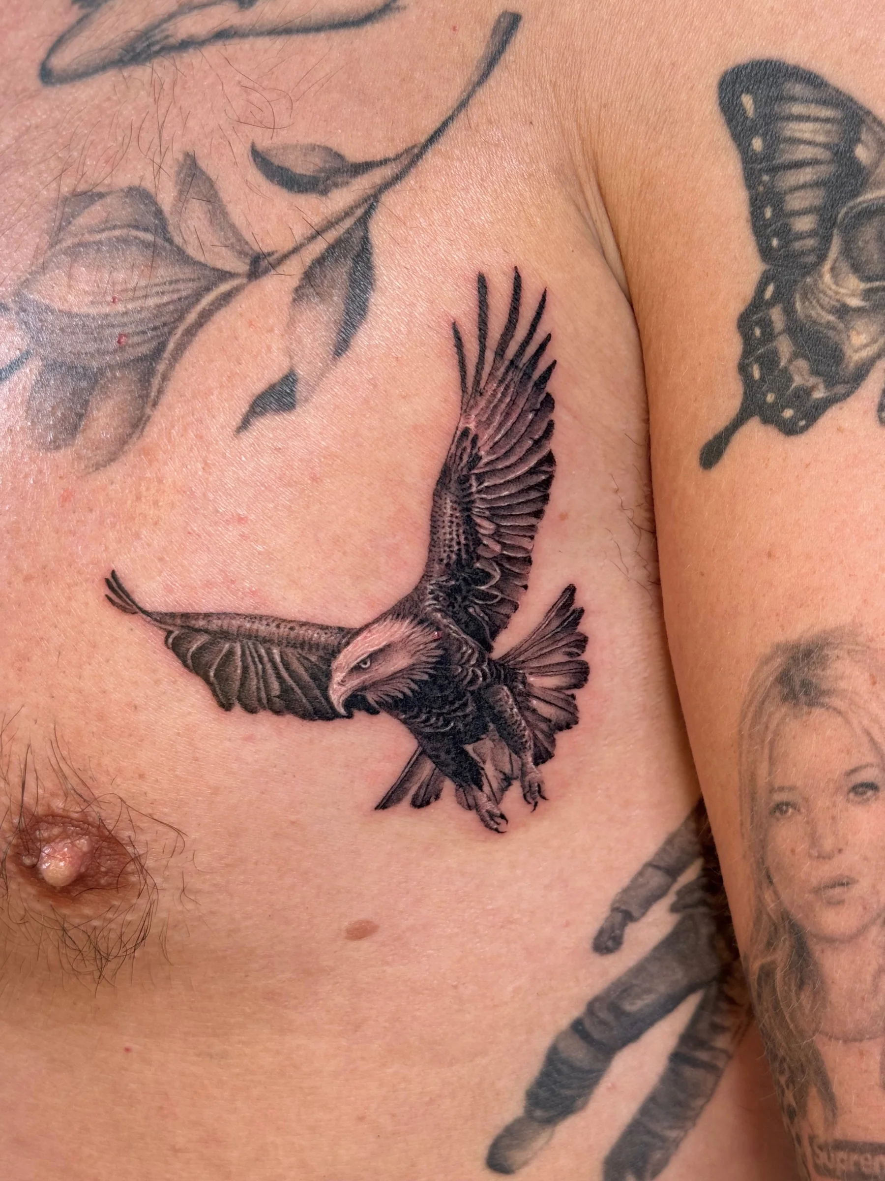 Eagle in flight tattooed on the chest